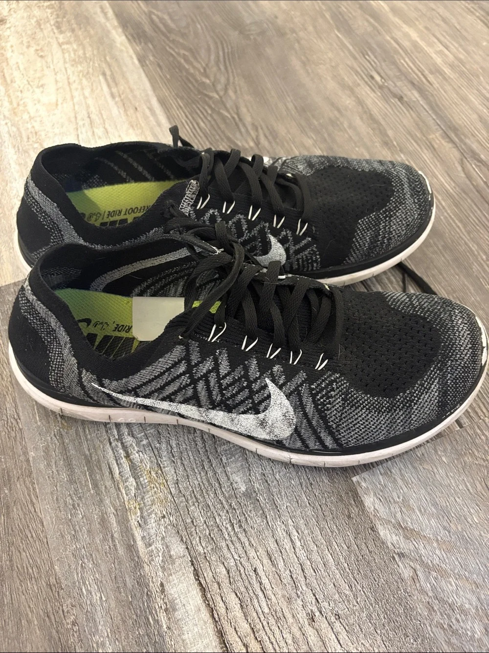 Nike Men’s Black and White Flyknit Athletic Sneakers
